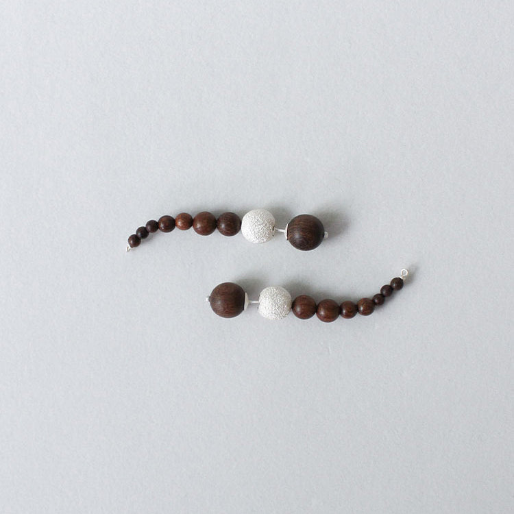 QIQI String Bendy Earrings in Zebra Wood